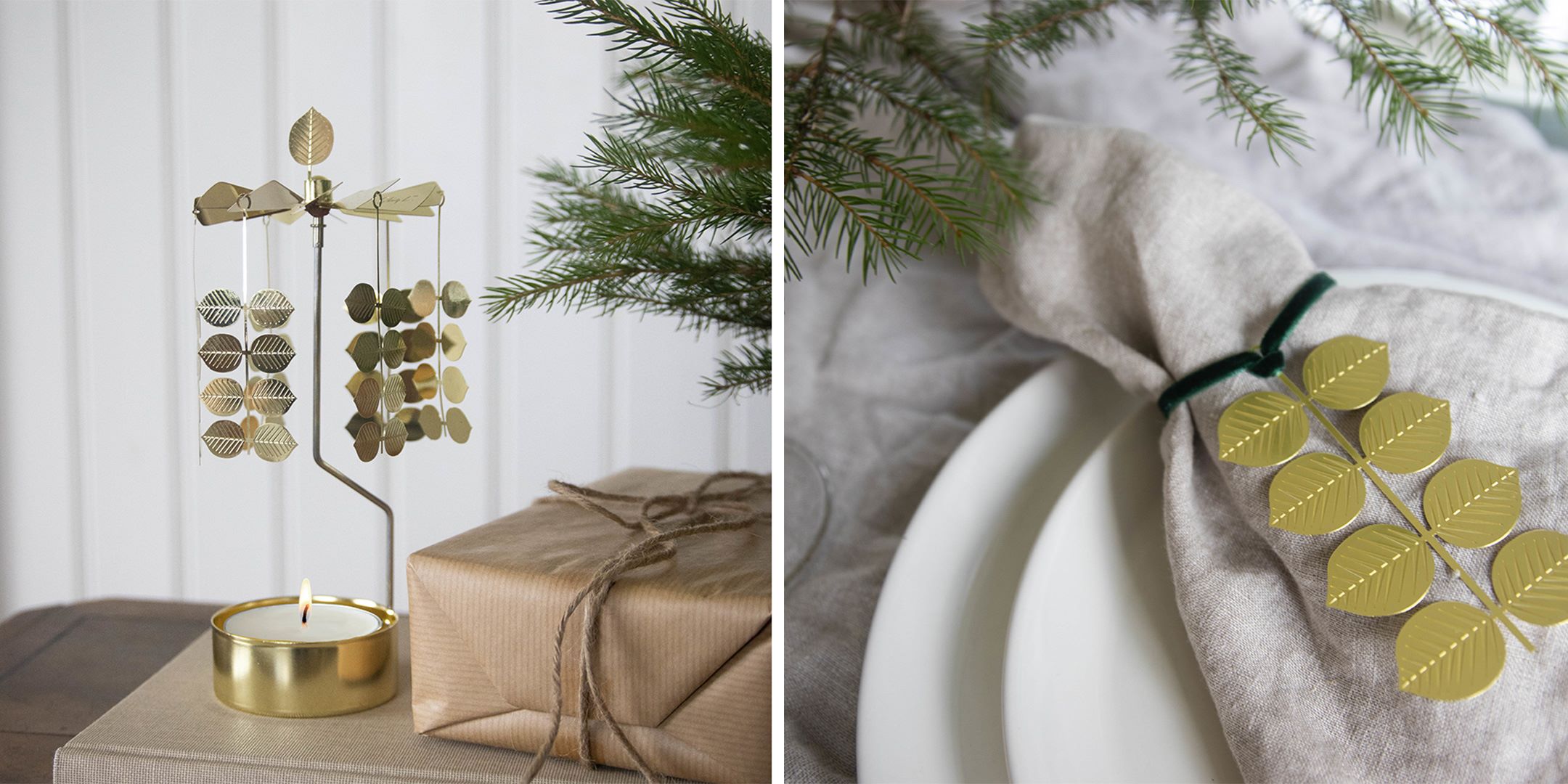 Metalliskt julpynt i guld med bladmotiv bredvid ett inslaget paket och julgran, samt en dukning med linneservett och guldfärgad servettring med blad