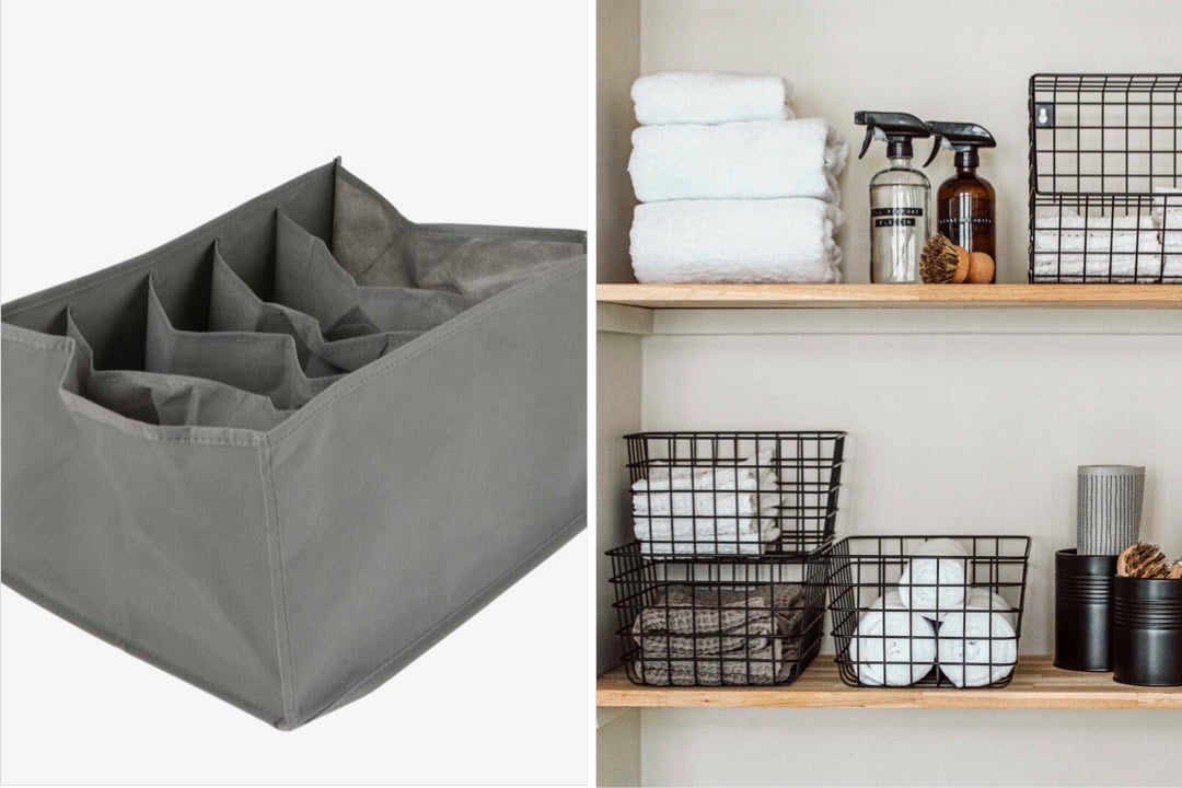 Grå förvaringslåda med fack bredvid en hylla med vikta handdukar, flaskor och korgar av metall