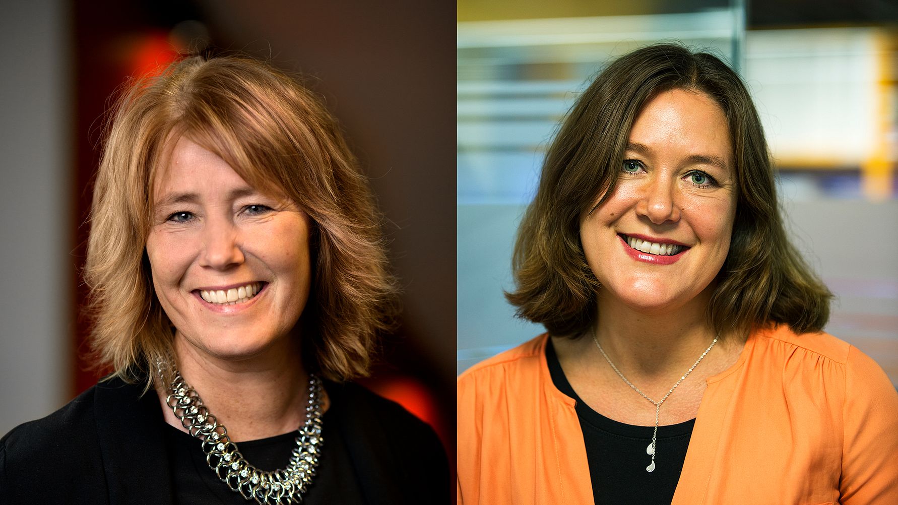 Två personer med axellångt hår, den ena klädd i svart med ett halsband och den andra i en orange topp, står inomhus med suddig bakgrund