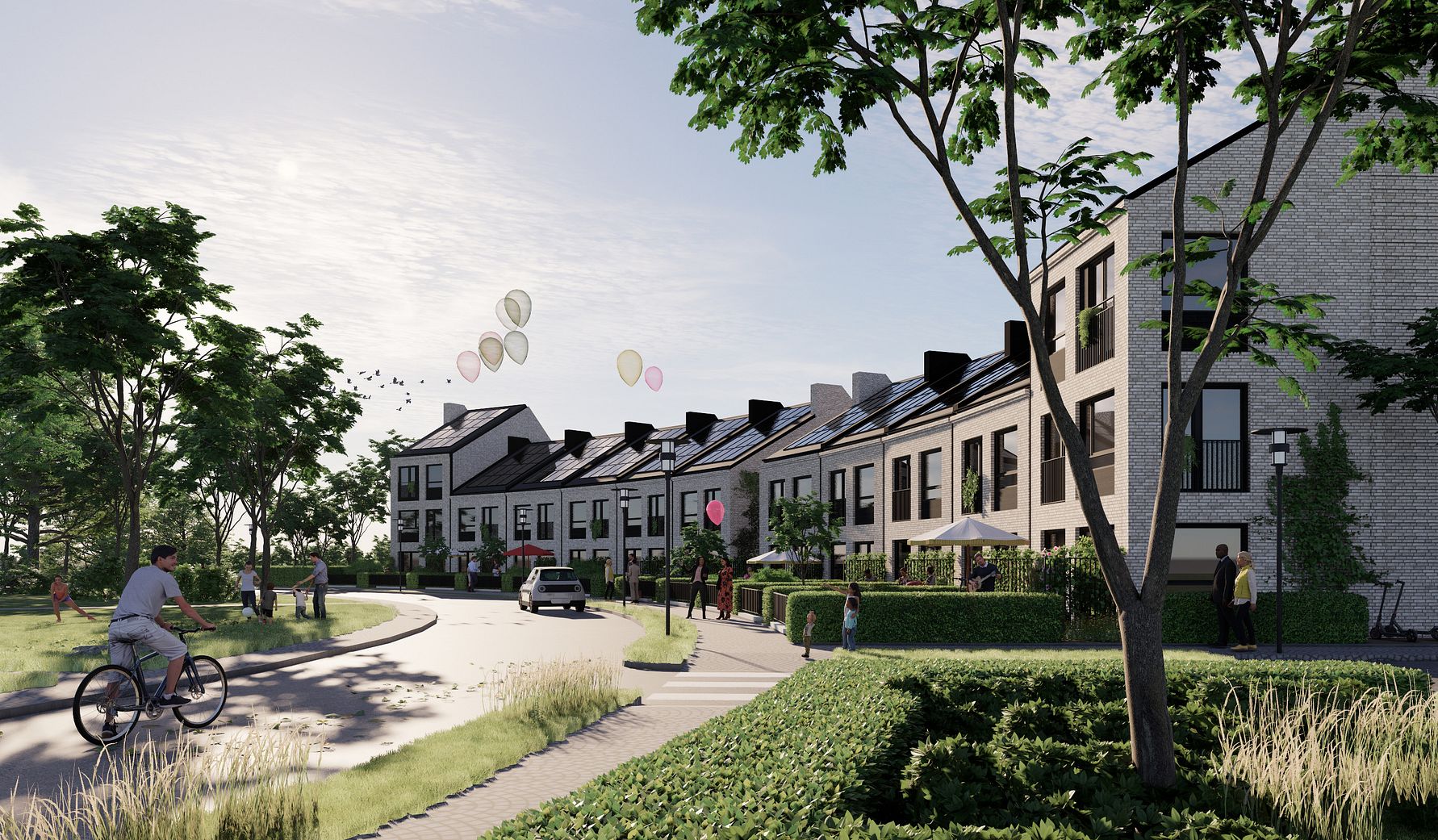 Rad av moderna bostadshus med solpaneler på taken, omgivna av grönska och träd, med människor som promenerar och cyklar i närheten. Ballonger syns svävande i luften