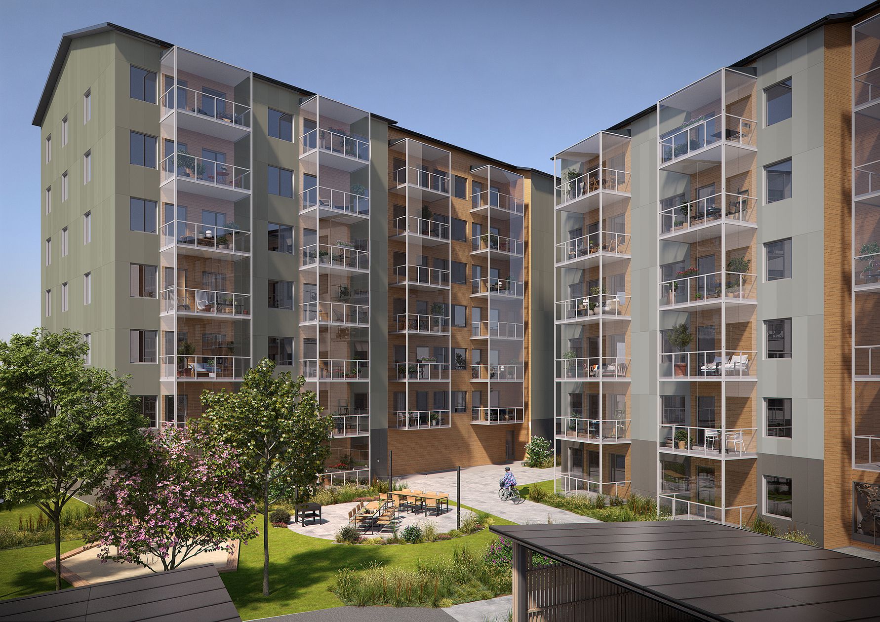 Flerbostadshus med moderna fasader, glasbalkonger och grönskande innergård med sittplatser och träd