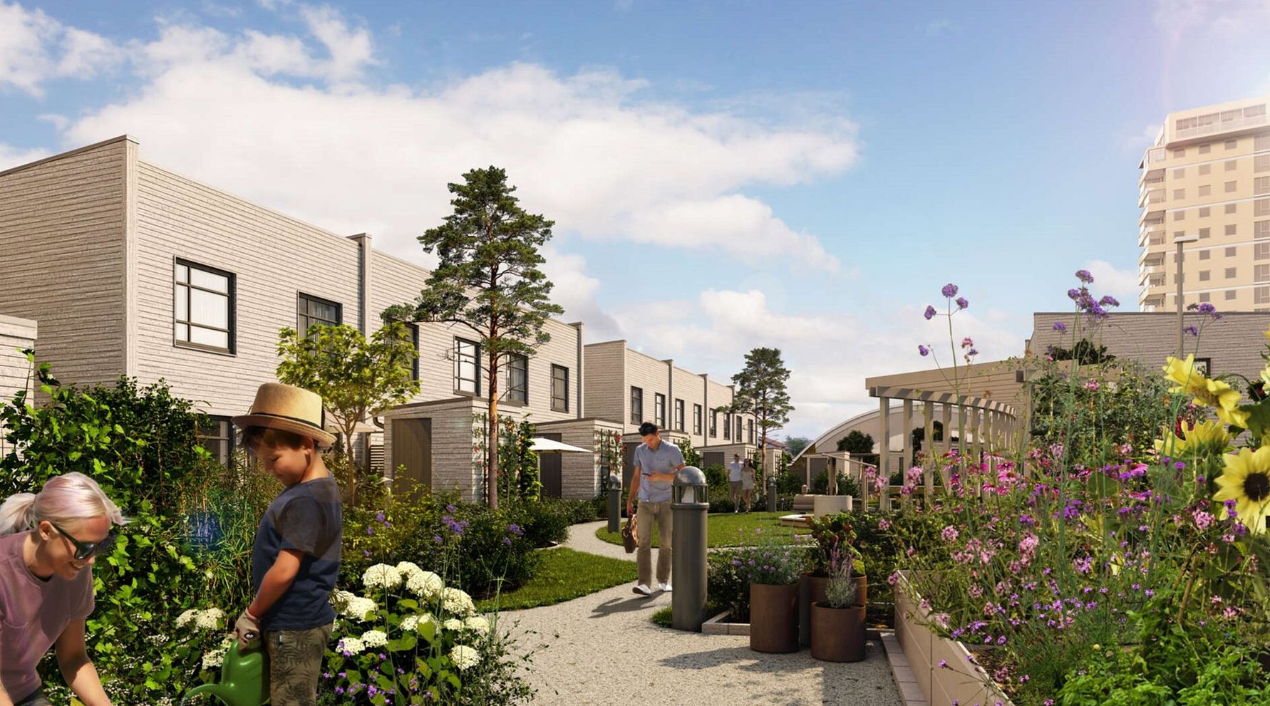 Nybyggt bostadsområde med radhus, grönskande trädgårdar, blommande växter och gångvägar under en klarblå himmel