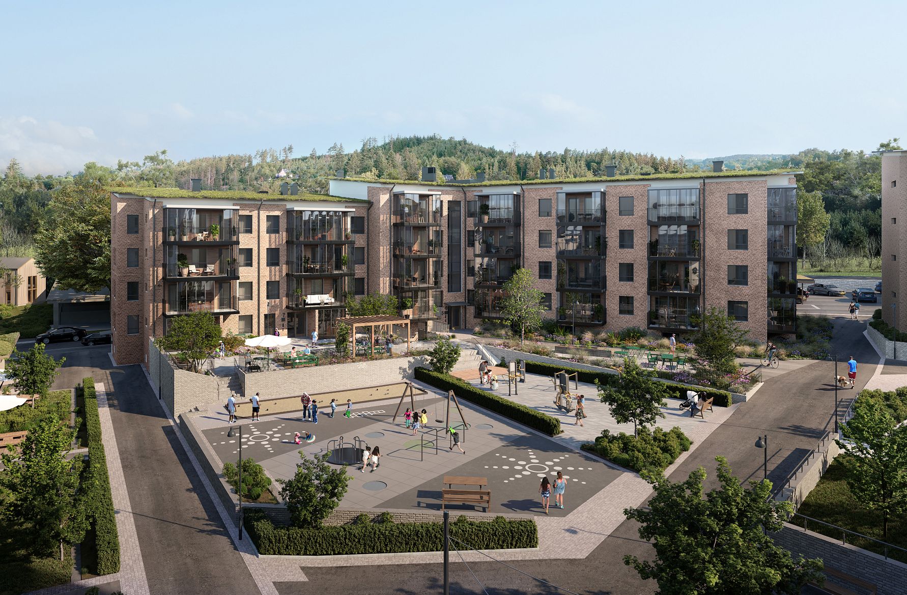 Nybyggda flerfamiljshus med modern arkitektur, omgivna av grönska och en lekplats i förgrunden