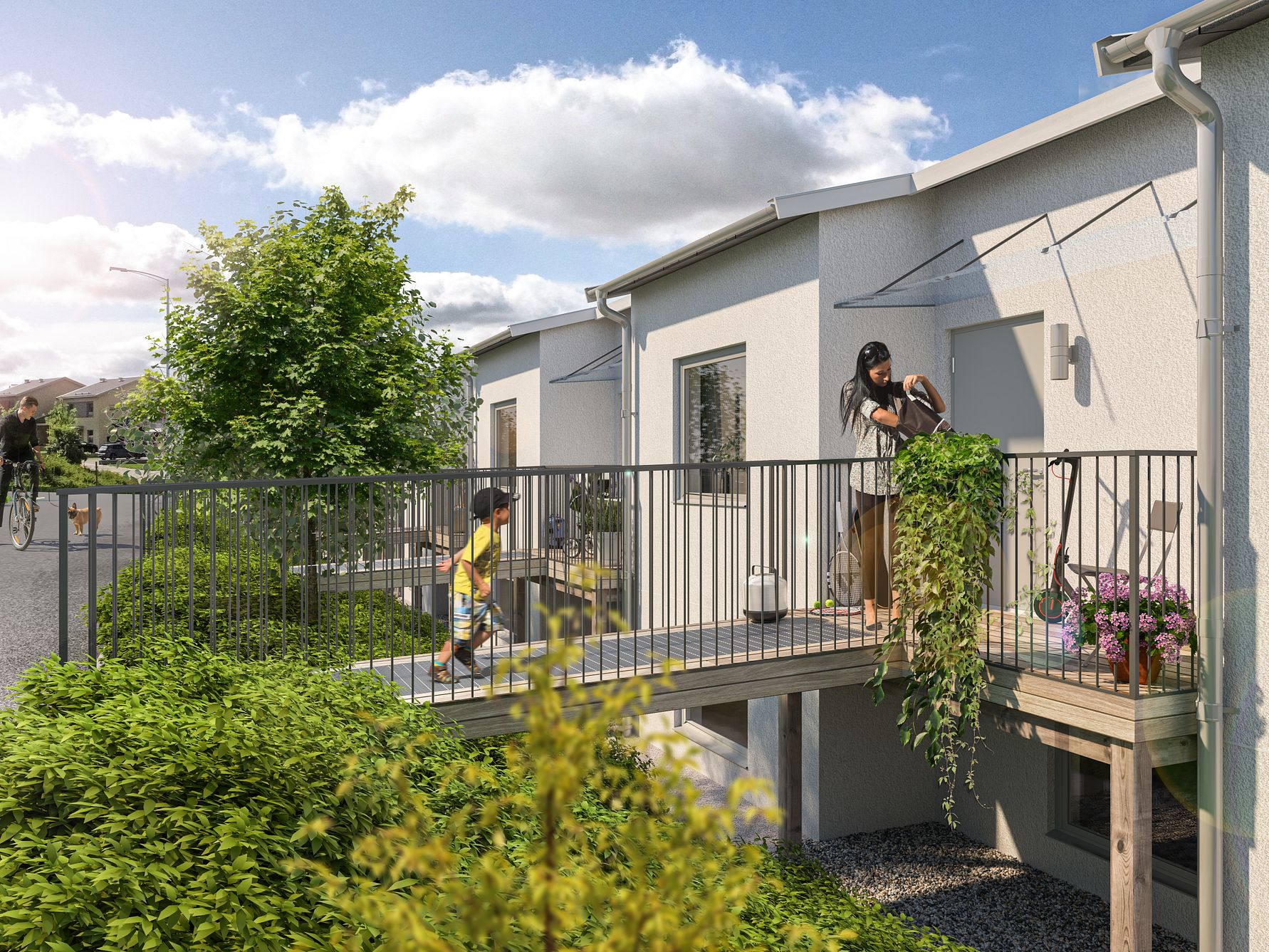 Miljöbild av radhus i modern skandinavisk stil med vita fasader, grönskande omgivningar och en person som vattnar växter på en balkong. En annan person syns på en gångbro framför bostaden