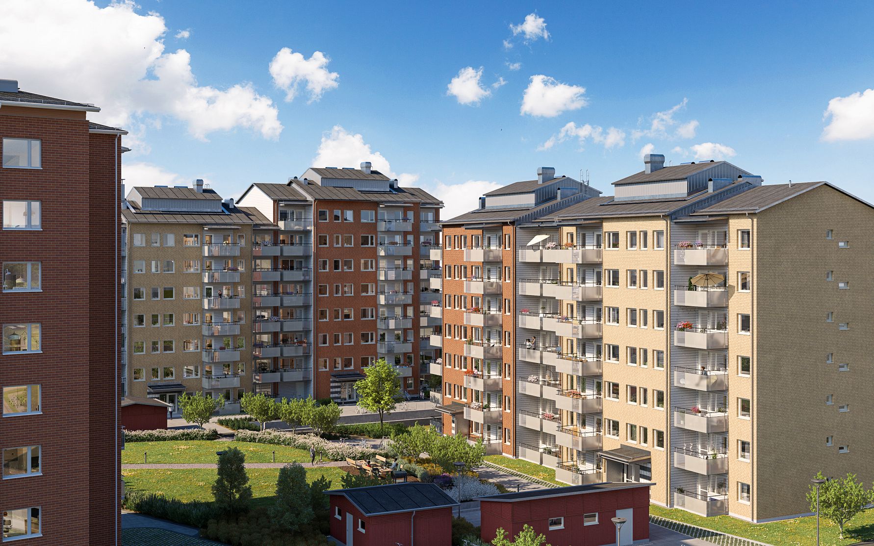 Flerbostadshus med fasader i olika färger, omgivna av grönytor och klart blå himmel i bakgrunden