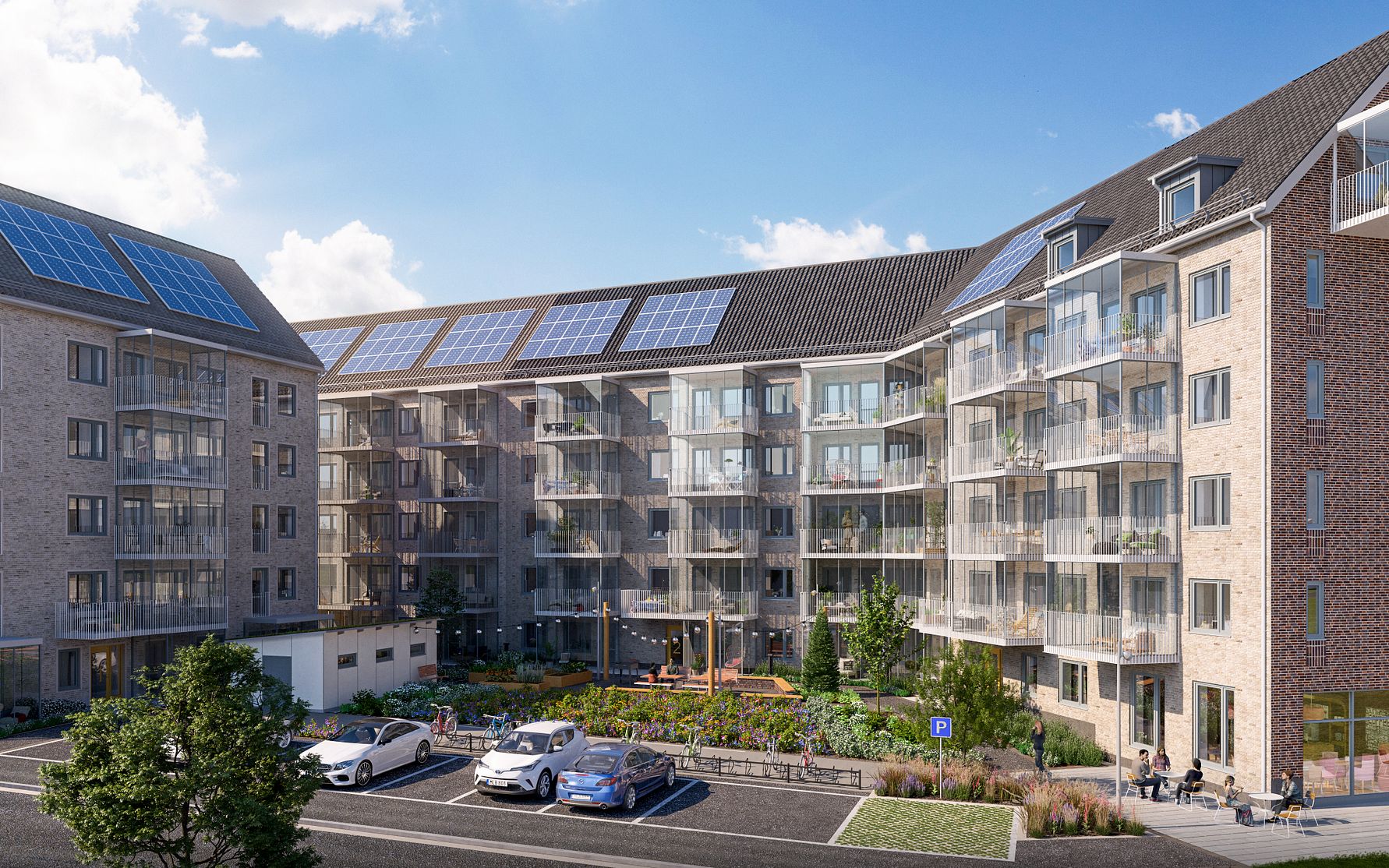 Lägenhetskomplex med modern arkitektur, stora fönster, balkonger, grönt innergårdsområde och solpaneler på taket under en klar blå himmel