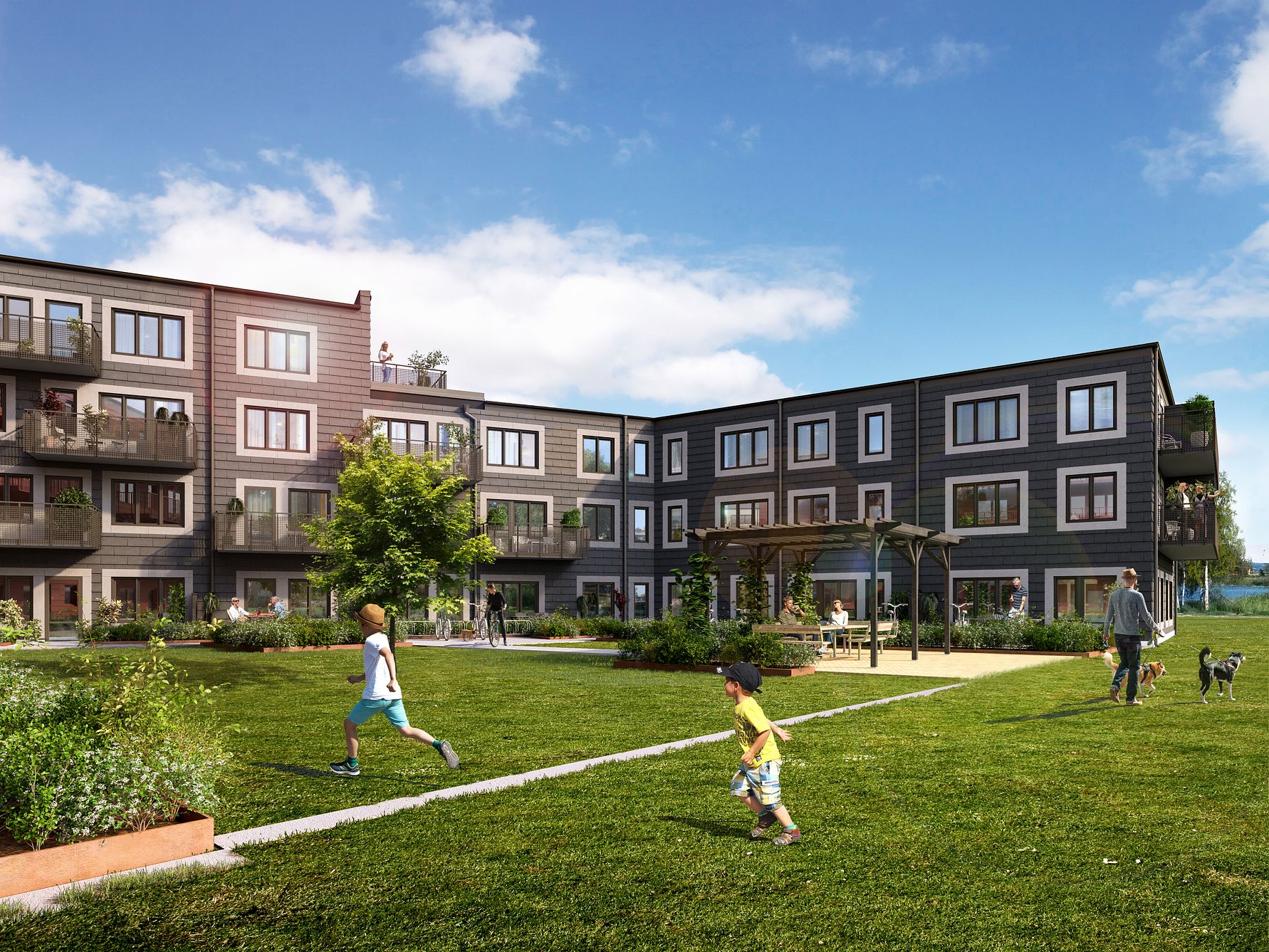 Bostadsområde med modern flerfamiljsbyggnad, grön innergård, barn som springer och lekplats i bakgrunden under en klarblå himmel