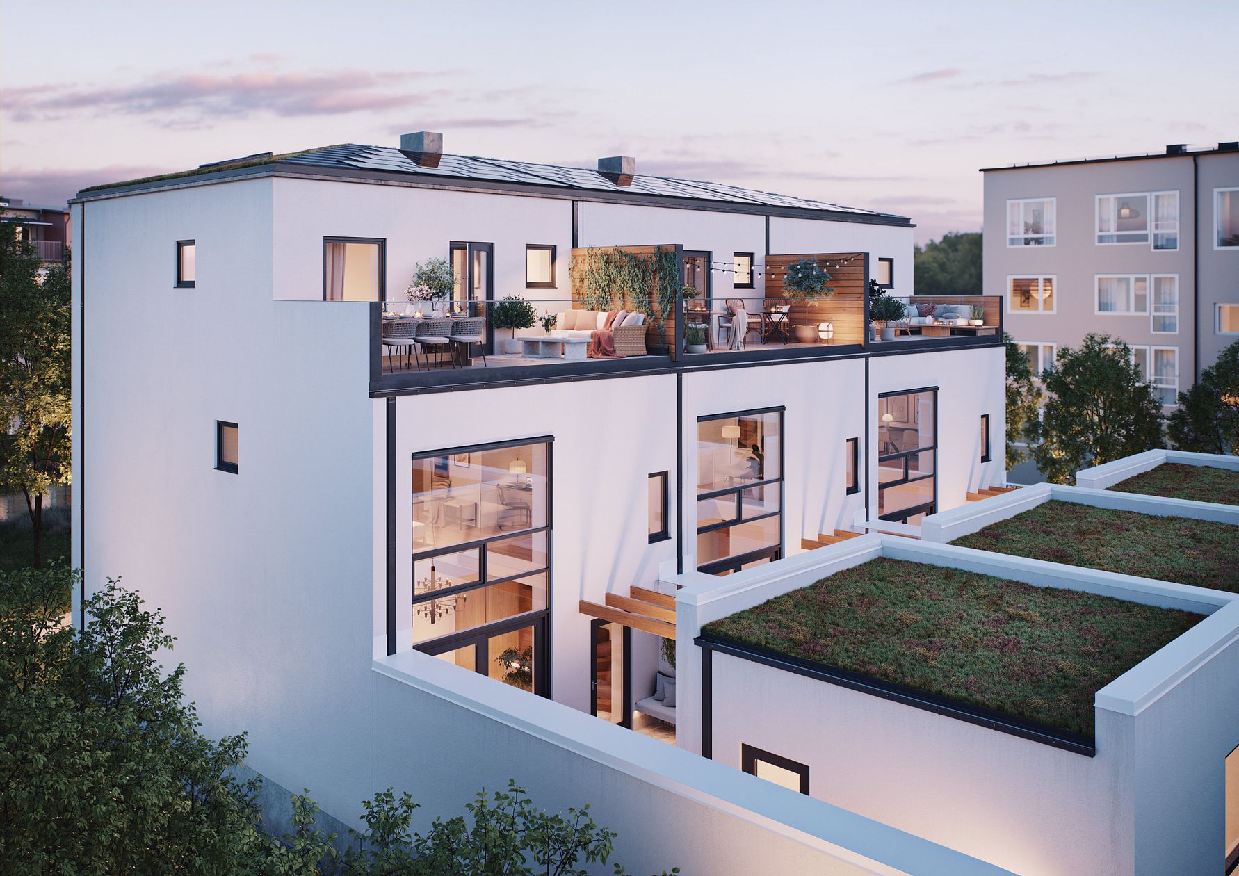 Modern vit byggnad med stora fönster och takterrass omgiven av grönska, del av ett bostadsområde