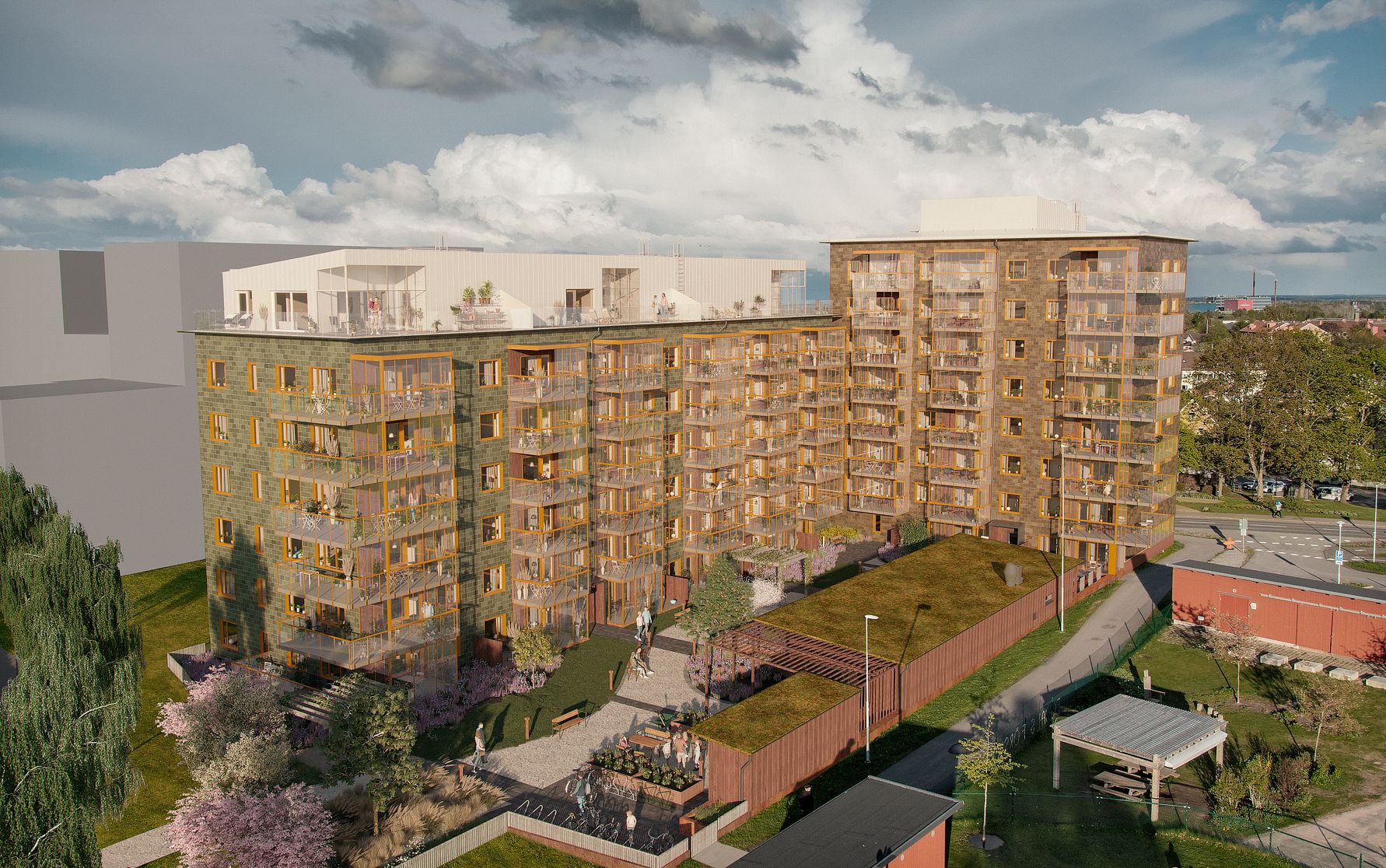 Lägenhetskomplex med flera våningar, fasad i trä och glas, omgiven av grönområden med gångvägar och uteplatser