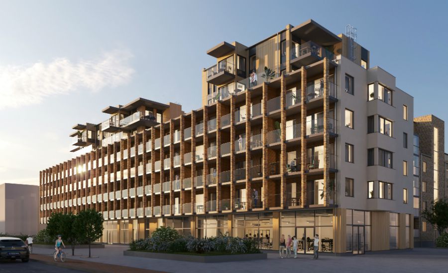 Flerbostadshus med modern arkitektur, stora fönster och balkonger, omgivet av träd och människor som promenerar