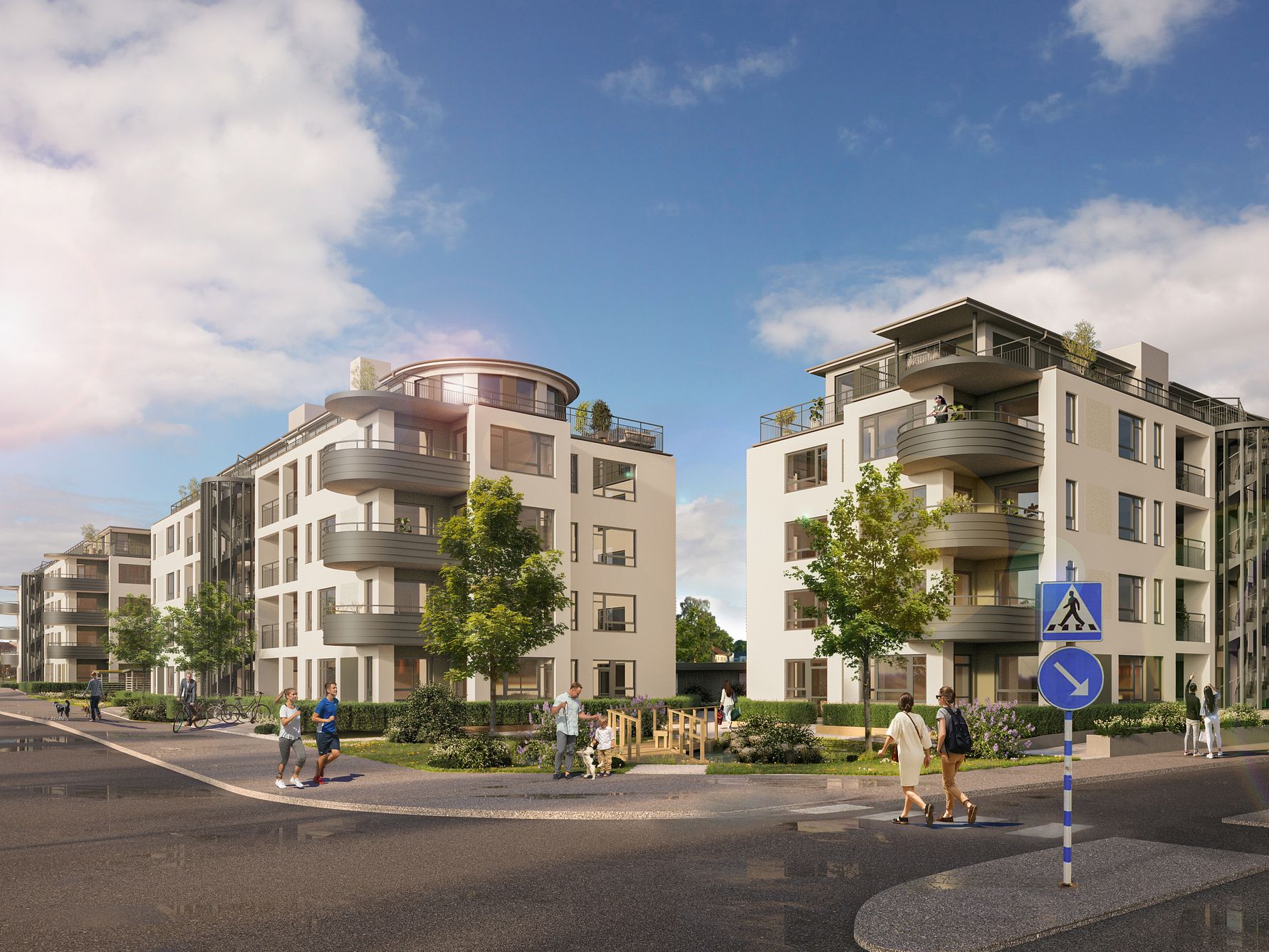 Flerfamiljshus i modern arkitektur med balkonger, omgivna av grönska och gångvägar; människor går och cyklar längs vägen under en klar himmel