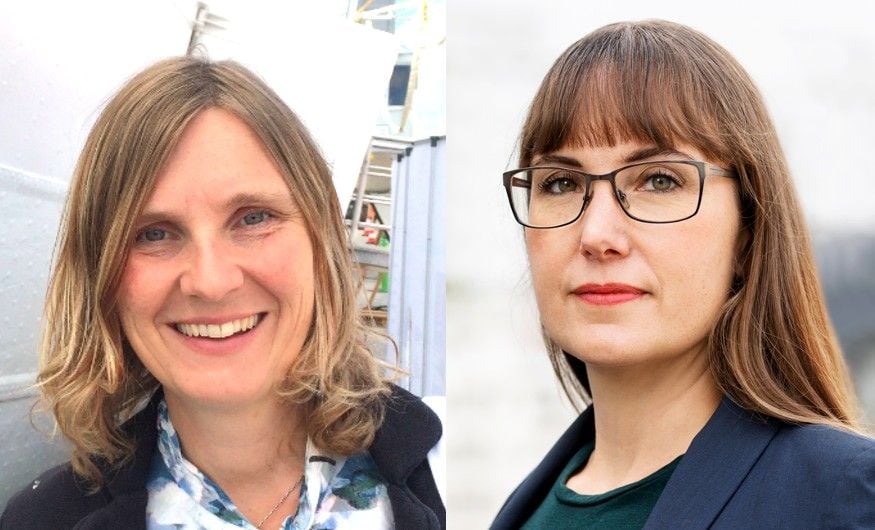 Två personer med brunt hår, den ena i en mönstrad skjorta och den andra i en mörk kavaj och glasögon, fotograferade utomhus