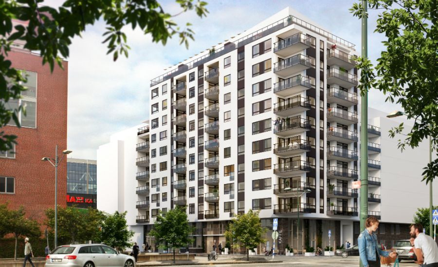 Modernt flerbostadshus med balkonger, omgivna av grönska och stadsmiljö