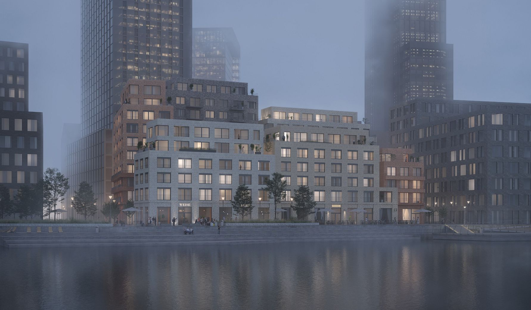 Flervåningsbyggnader vid en vattenkant i dimmigt kvällsljus, med reflektioner synliga i vattnet