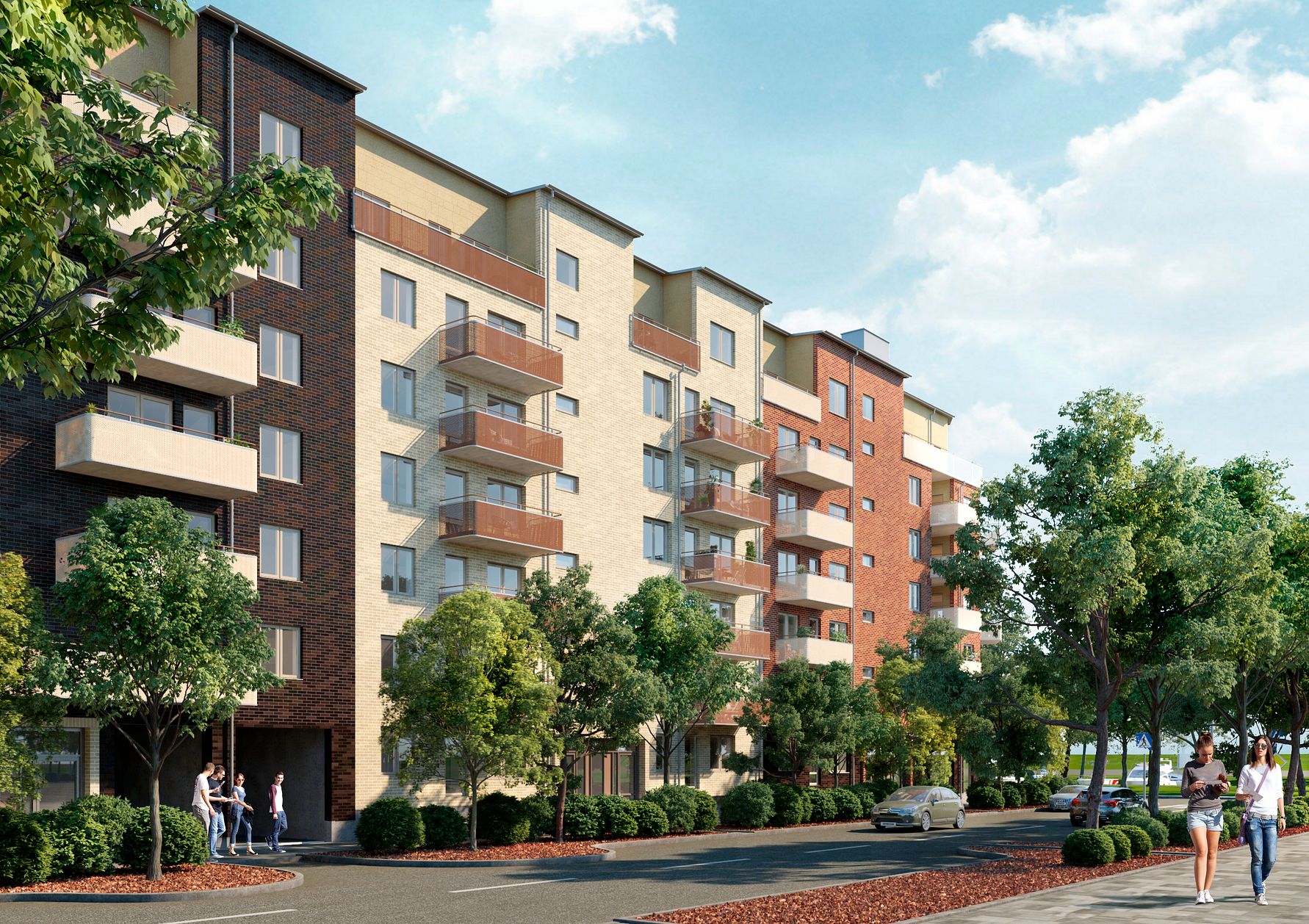 Flerfamiljshus med moderna fasader i olika färger, balkonger och träd framför byggnaden på en solig dag