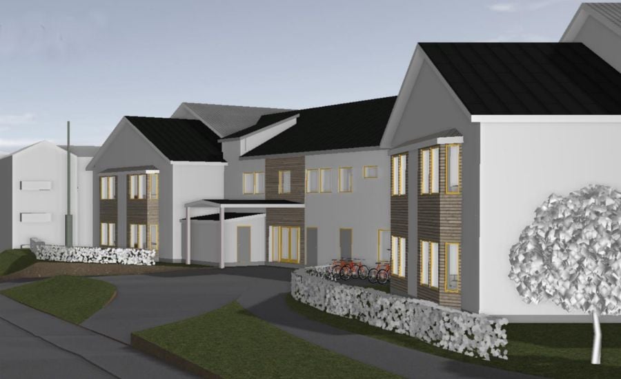 Illustration av moderna bostadshus med vita fasader och mörka tak, omgivna av grönska och en cykelparkering