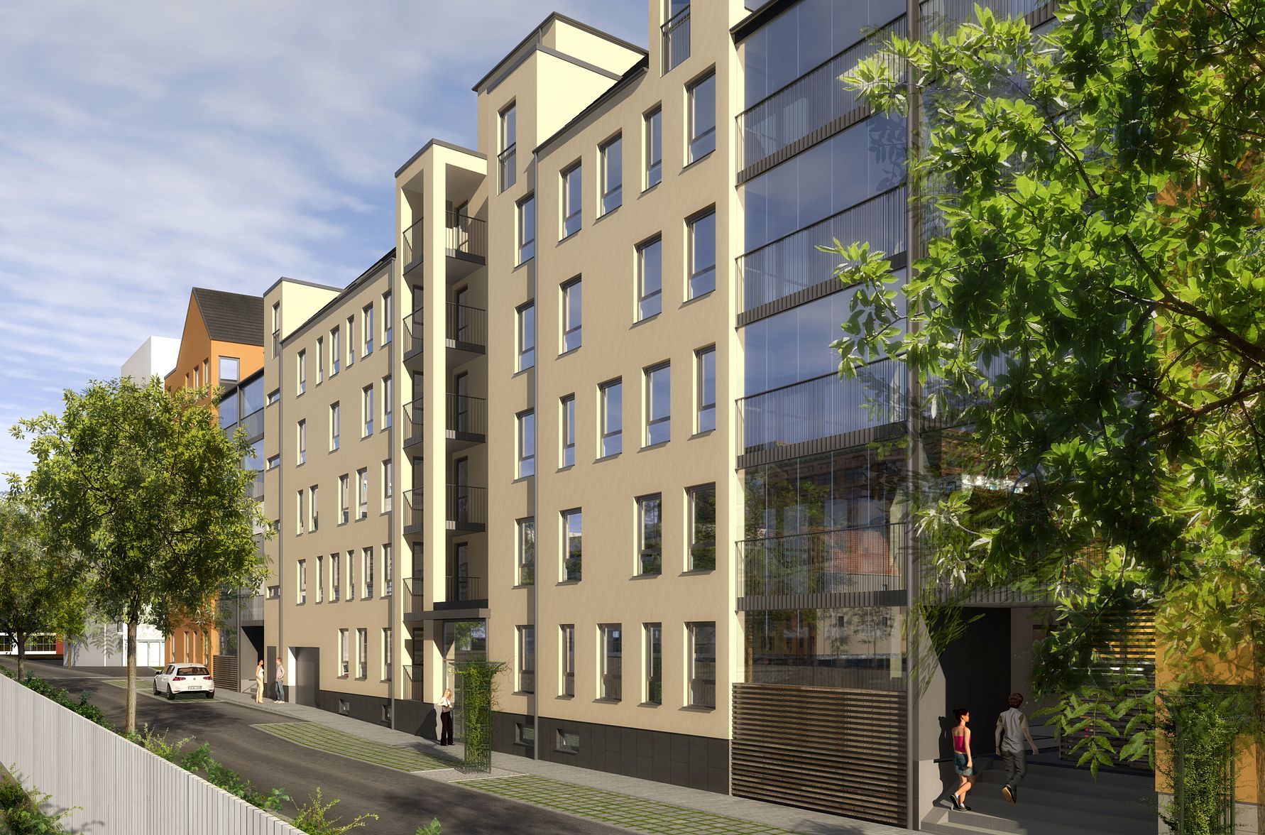 Modernt flerfamiljshus i stadsområde, med fasad i ljusa färger och stora glaspartier, omgiven av träd och trottoar