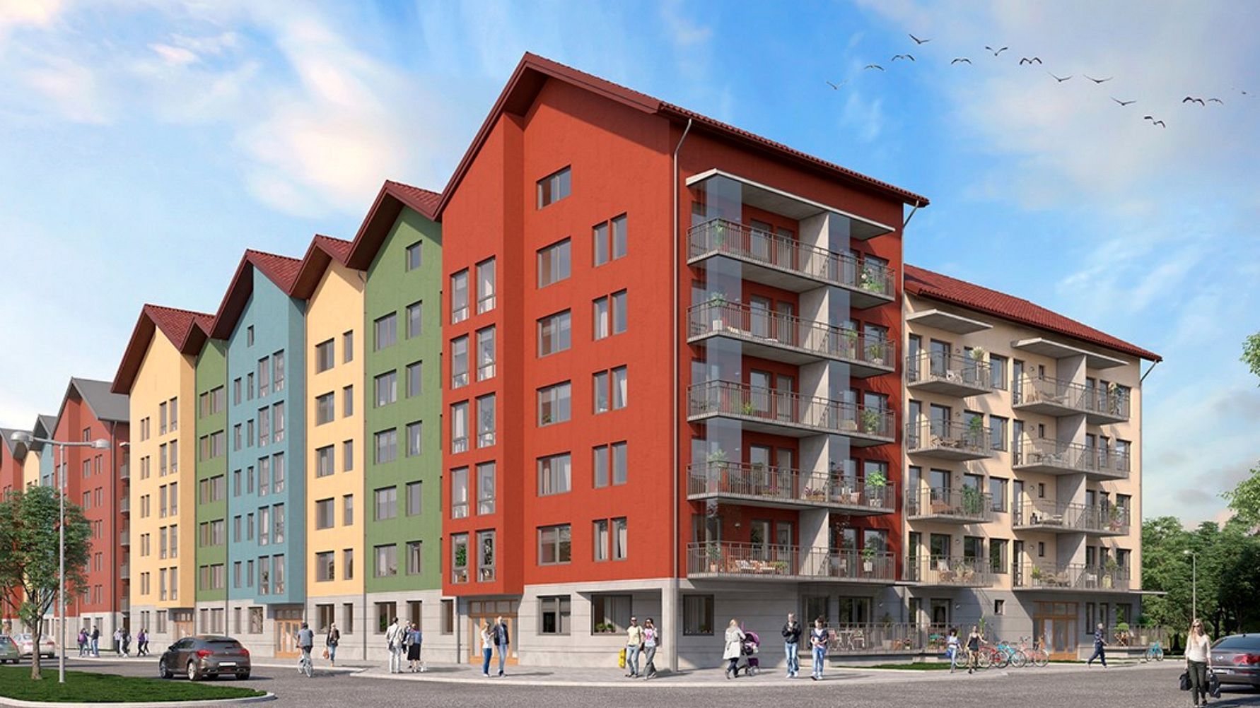 Flerbostadshus med färgglada fasader, glasbalkonger och röda tak mot en klarblå himmel