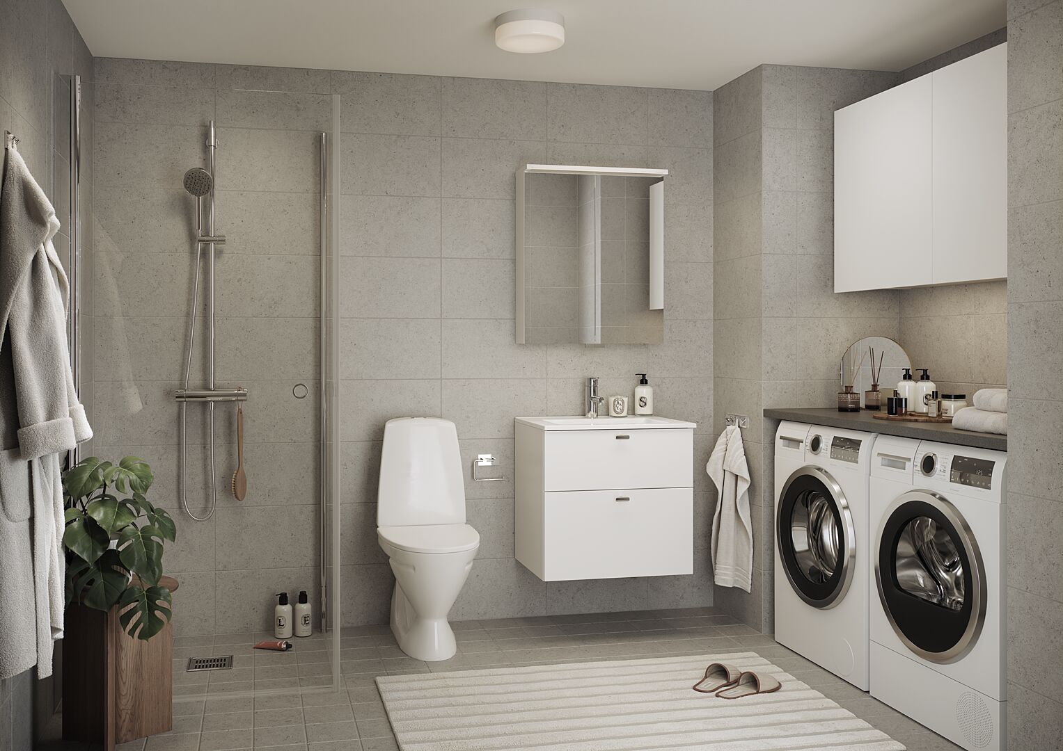 Badrum med dusch, toalett, kommod och tvättmaskin samt torktumlare