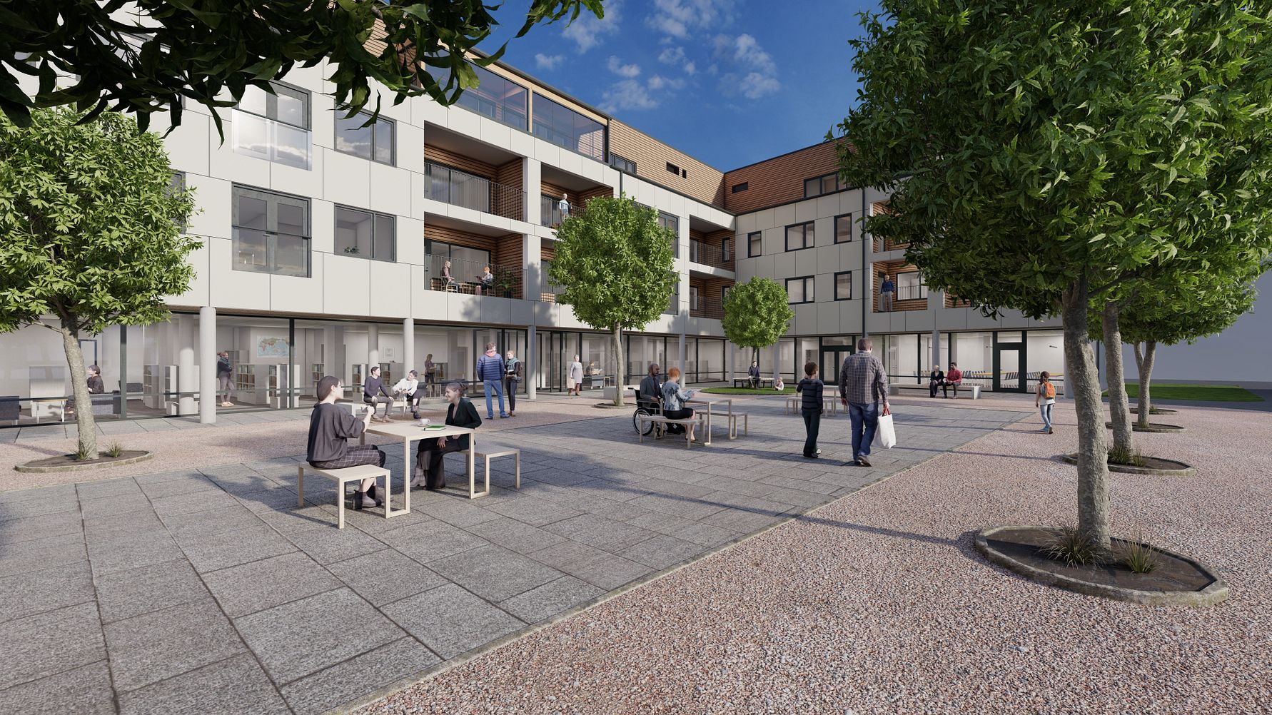 Bostadshus med modern arkitektur, omgiven av ett stenläggningsområde med sittplatser och träd, människor sitter och står i området