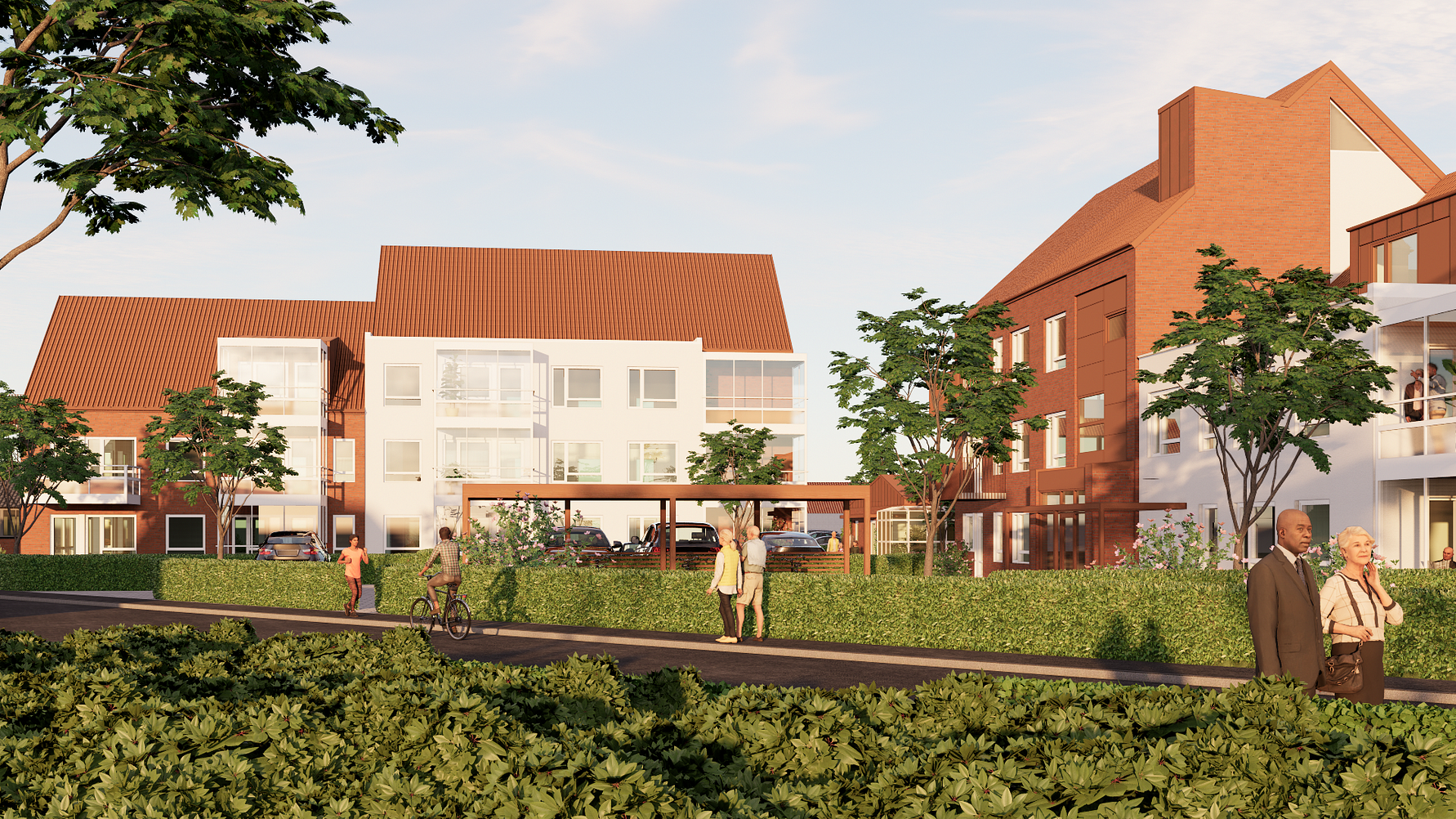 Två moderna bostadshus med vita och röda fasader, omgivna av grönska och gångvägar, med människor som promenerar och cyklar i ett soligt bostadsområde