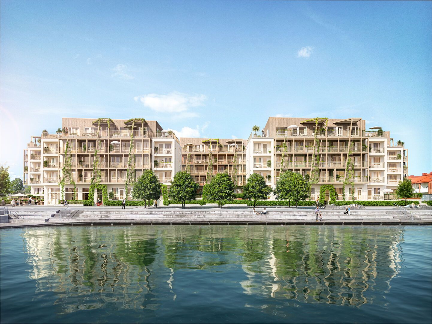 Inflyttningsklar lägenhet vid vattnet med modern bostadsbyggnad och grönska