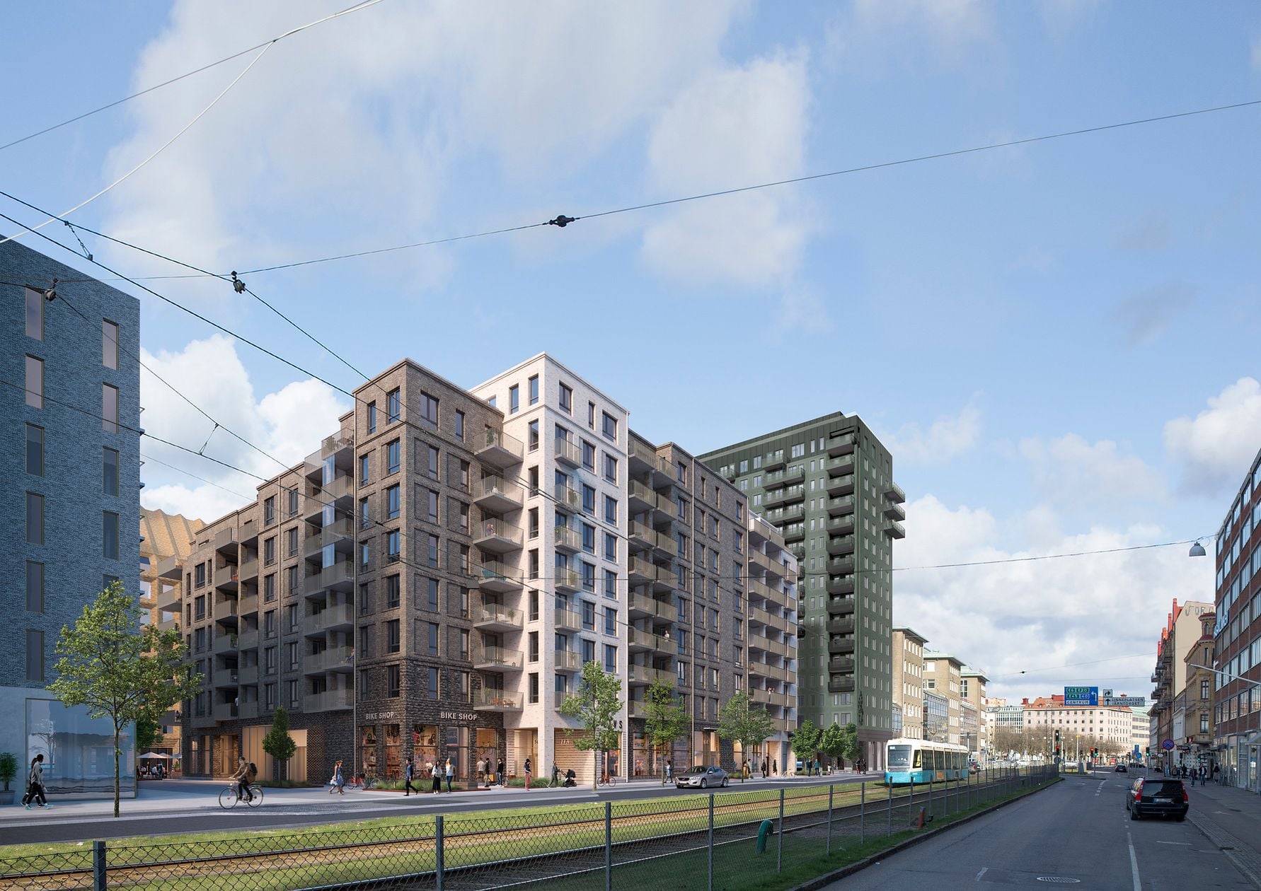 Moderna flerbostadshus längs en stadsgata med träd, cyklister och en spårvagn under en blå himmel