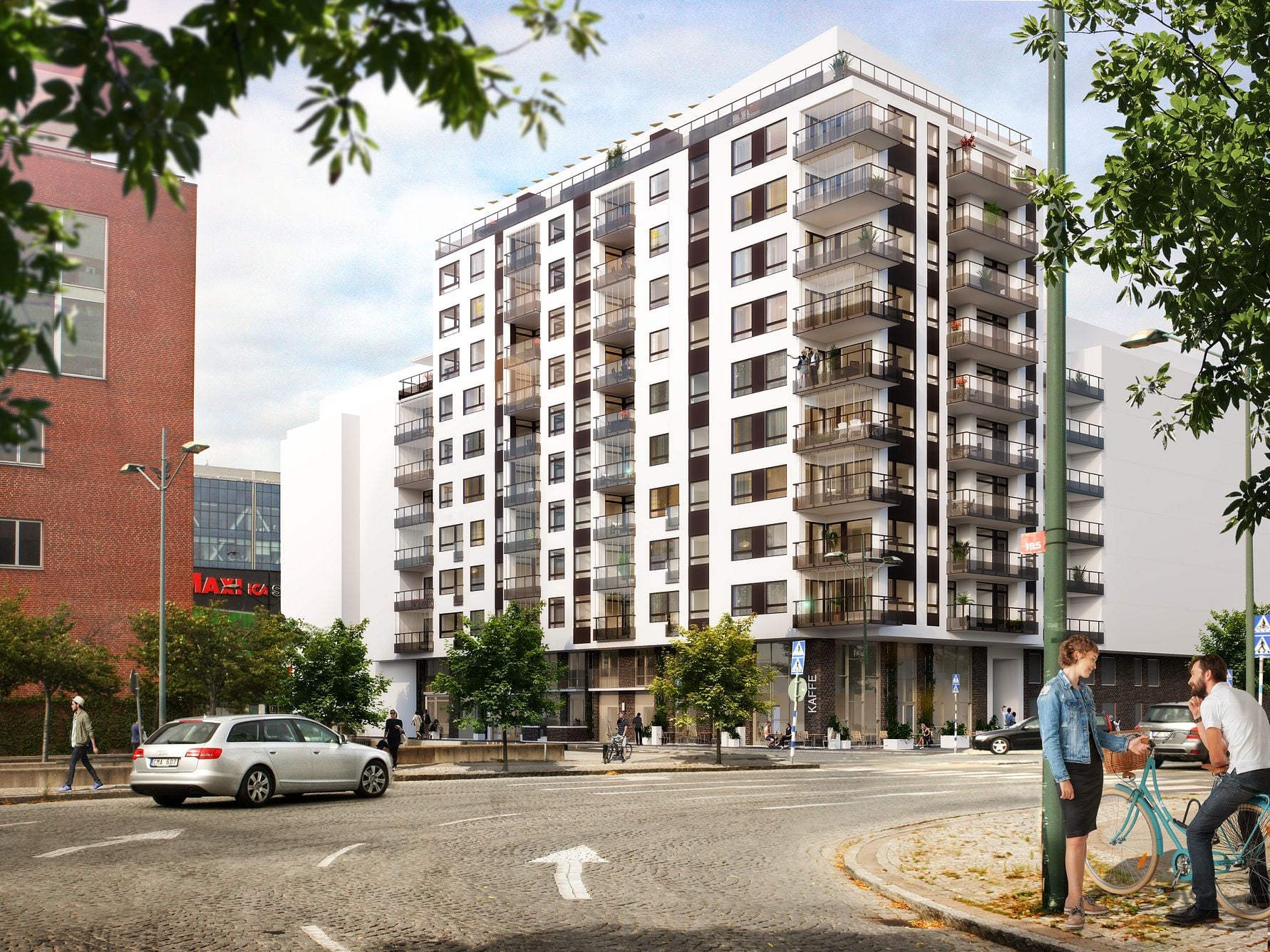 Modernt flerbostadshus med balkonger, omgiven av träd, parkering och människor på en solig gata