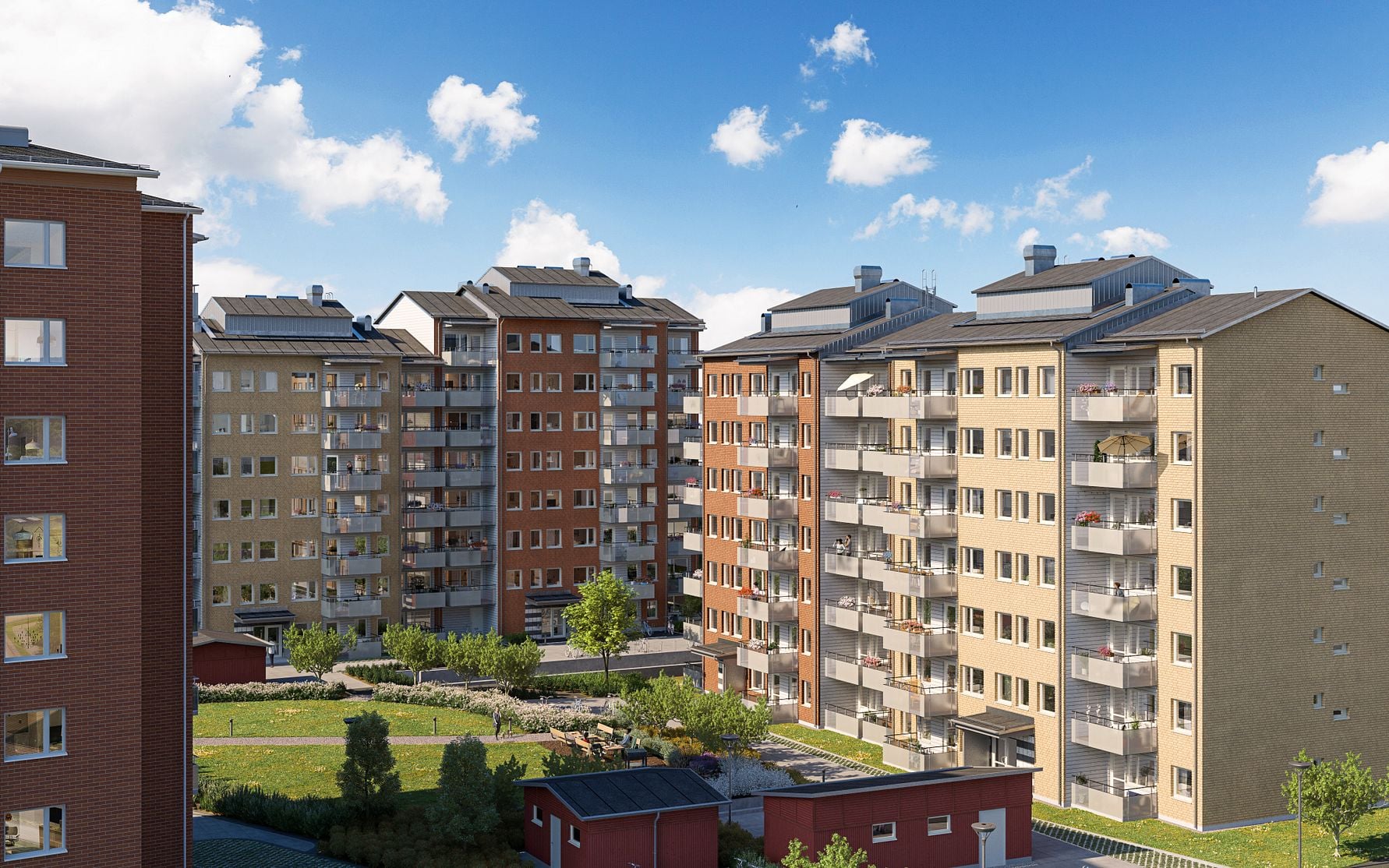Flerbostadshus med fasader i olika färger, omgivna av grönytor och klart blå himmel i bakgrunden
