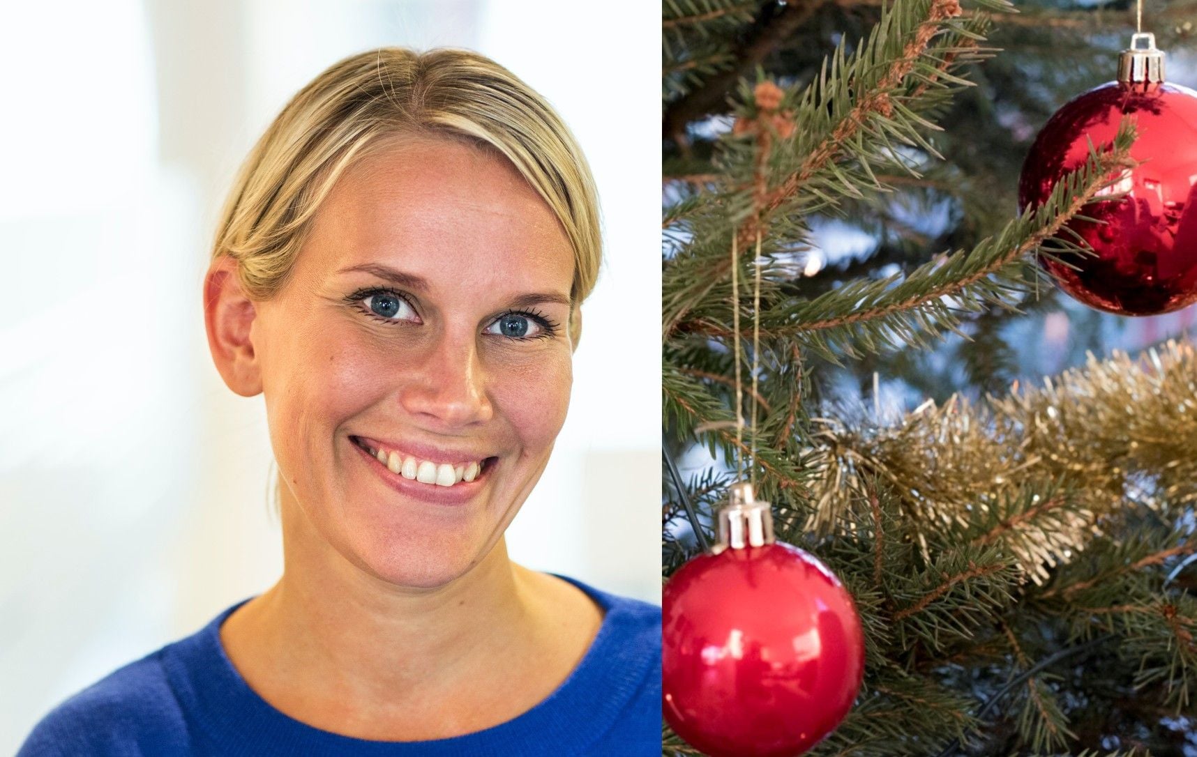 Person i blå tröja bredvid en julgran dekorerad med röda julkulor