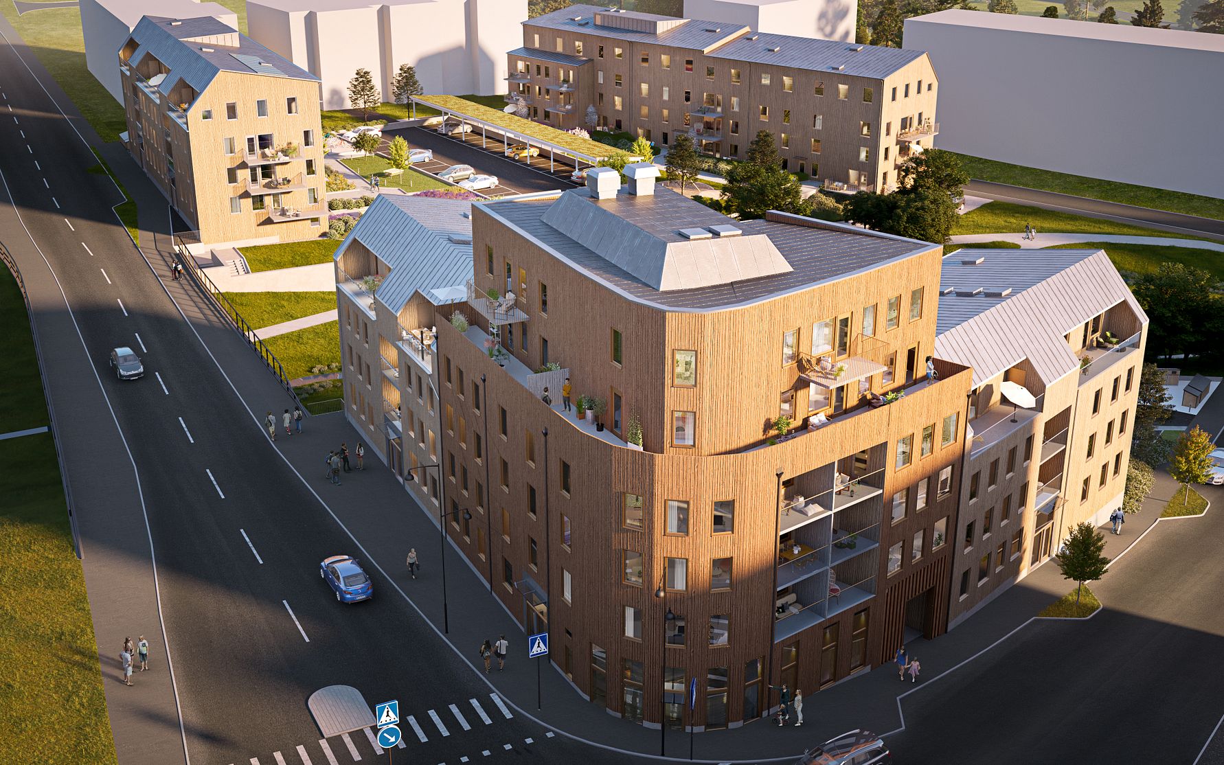 Flerbostadshus i trä med balkonger och takterrasser, beläget vid en gata med trottoarer och grönområden i en stadsdel