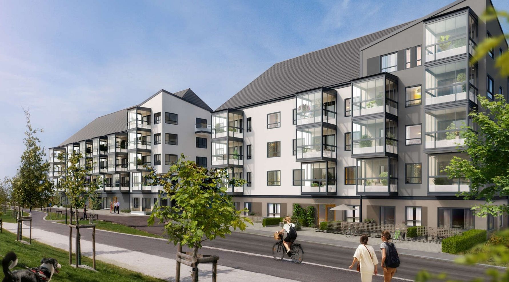 Flerbostadshus med modern arkitektur, glasbalkonger och en gata med cyklister och fotgängare i förgrunden