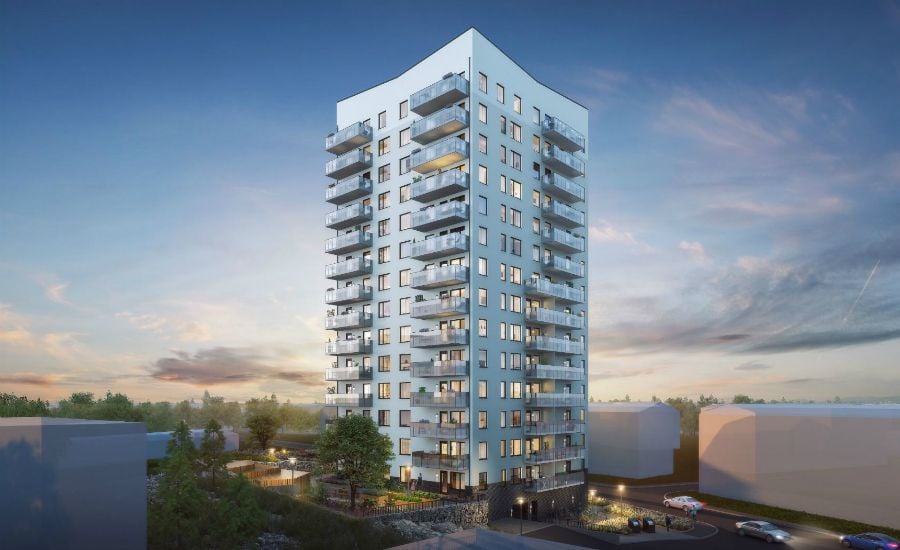 Höghus i modern stil med flera balkonger, omgiven av grönska och upplyst i kvällsmiljö