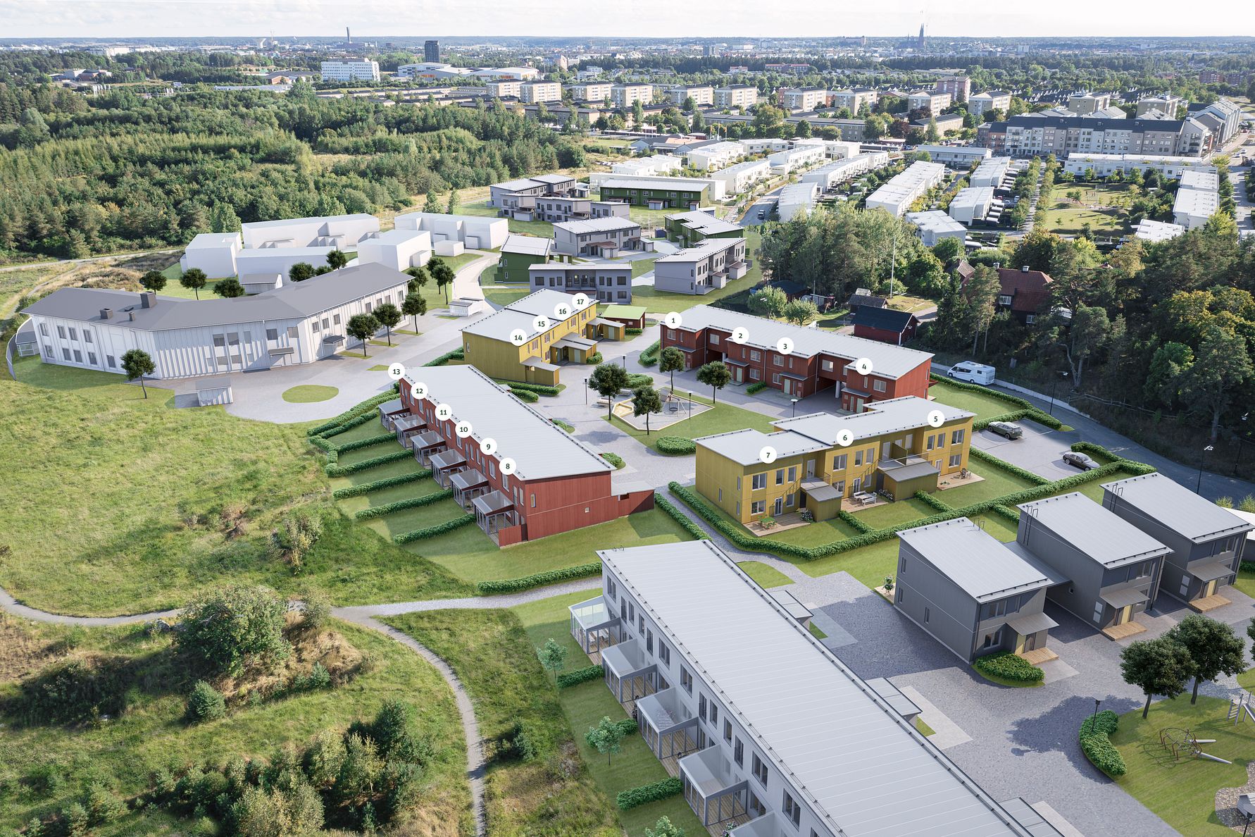 Flygvy över ett bostadsområde med flerfamiljshus och radhus omgivna av grönområden, vägar och andra byggnader