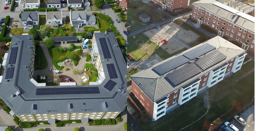Flygfoto av två byggnader med solpaneler på taket, omgivna av grönområden och bostäder