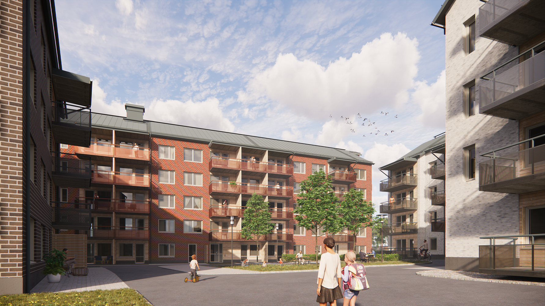Flerbostadshus med röda och vita fasader, omgivna av grönska och en innergård där människor promenerar