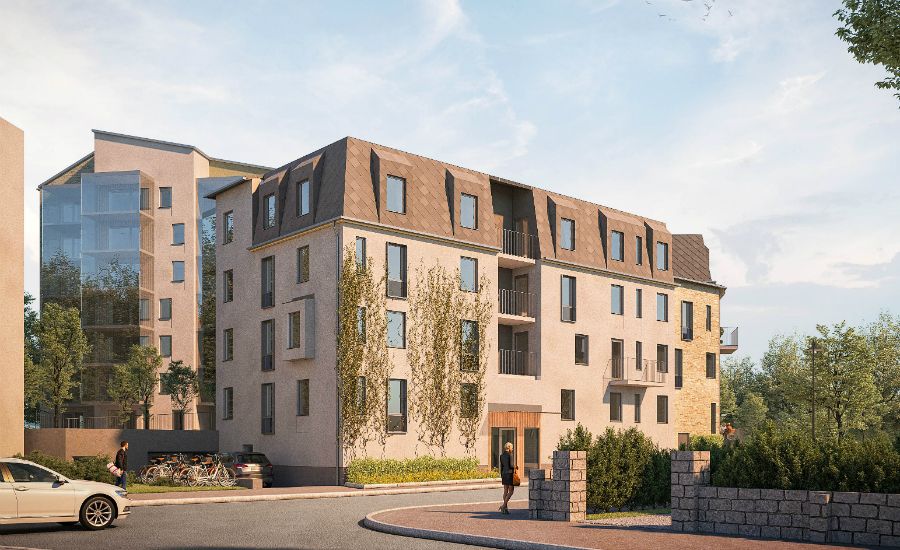 Flerbostadshus med modern arkitektur, gröna omgivningar och parkeringsområde i förgrunden