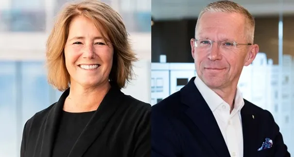 Två leende personer, en kvinna och en man, porträtterade i professionell miljö