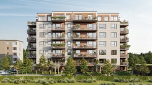 Flerbostadshus med modern arkitektur, flera balkonger och grönskande utomhusmiljö