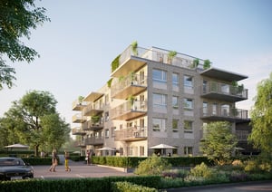 Ett modernt flerfamiljshus med ljus fasad, stora balkonger och grönska på taket, omgiven av träd och välskötta trädgårdar