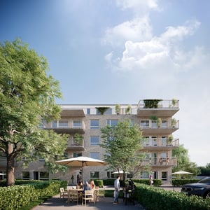 Flerfamiljshus i modern design, omgiven av grönska, med människor som sitter vid ett bord under ett parasoll på gården