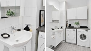 Inflyttningsklart badrum med vit kommod, spegel, tvättmaskin och torktumlare