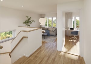 Modernt inredd hall med trappa, vardagsrum och arbetsrum i ljus lägenhet