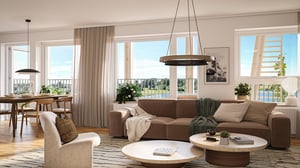 Ljust vardagsrum med brun soffa, fåtölj, matplats och stora fönster mot utsikt över vatten