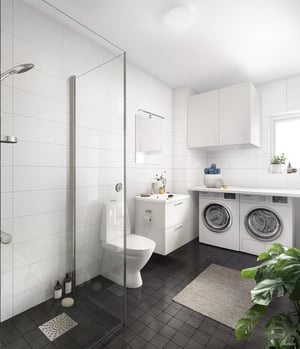 Badrum med dusch, toalett, handfat och tvättmaskin samt torktumlare