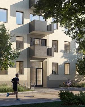 Flerbostadshus med balkonger och gröna trädgårdsmiljöer, med en löpare i förgrunden och två personer sittande på en bänk