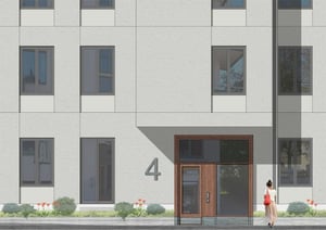 Modern fasad och entré, en kvinna går förbi huset