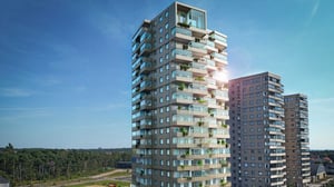 Flerbostadshus med balkonger och utsikt mot skog