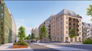 Modern bostadskvarter med flerfamiljshus, träd och människor längs en bred gata