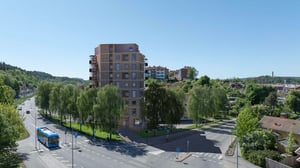 Illustration av flerbostadshus med grönskande omgivning och stadsvy